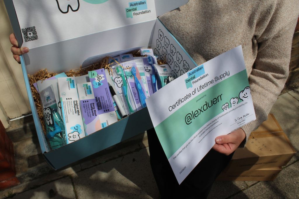 Close-up of the Australian Dental Foundation’s lifetime supply of toothpaste certificate and giveaway box.